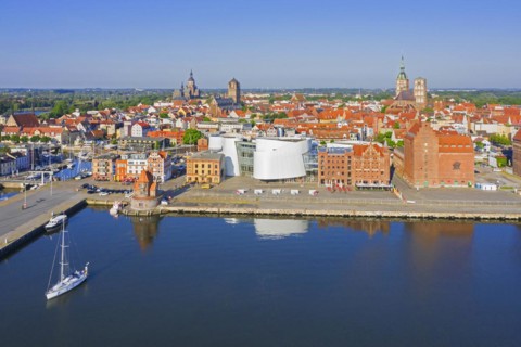 Aerial view over waterfront and public aquarium Ozeaneum in harbour of the Hanseatic City of Stralsund in summer