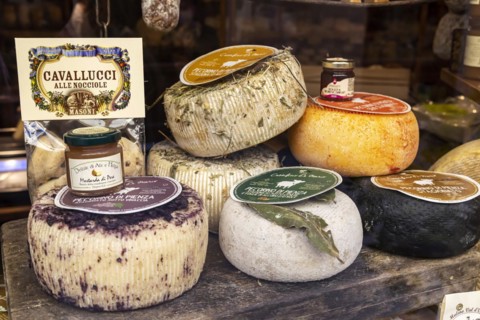 Cheese shop in the narrow streets of the old town of Pienza