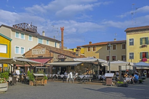 Tourists at restaurants in the historic city centre of Caorle