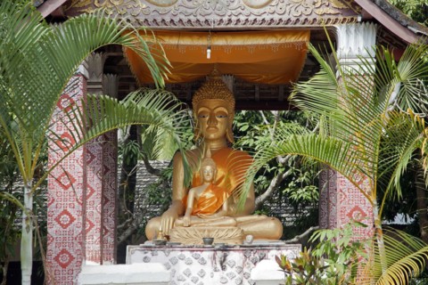 Sitting Buddha statue in temple at Luang Prabang
