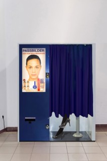Passport photo machine with person