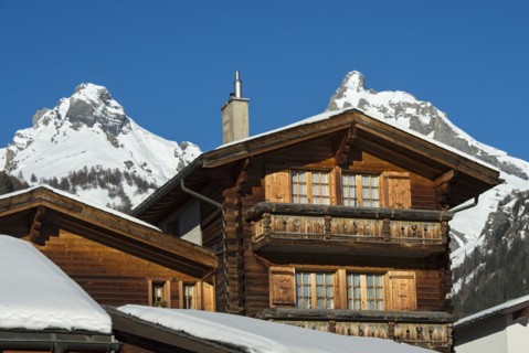 Typical Valais chalet in the wintry Swiss Alps
