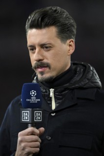 TV pundit Sandro Wagner interviewed by microphone Logo DAZN