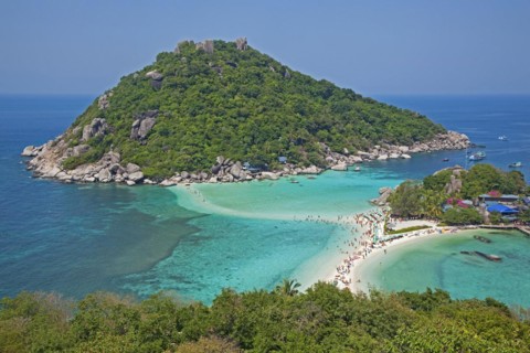 Western tourists sunbathing on beach of Ko Nang Yuan