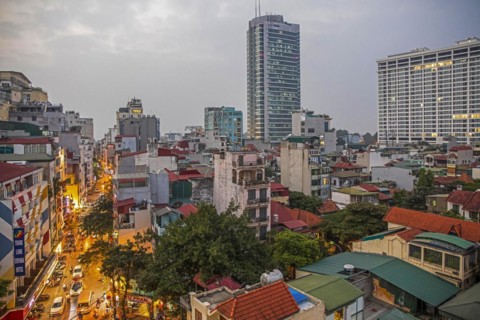 Aerial view over the busy city centre of Hanoi showing highrise buildings