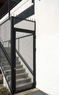 Exterior staircase blocked with fence