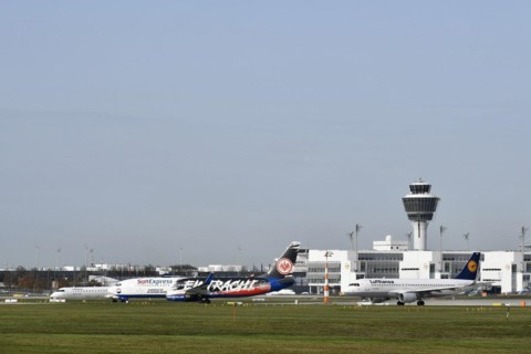 SUNEXPRESS BOEING 737-800 special livery football club Eintracht Frankfurt taking off on runway south with Lufthansa aircraft