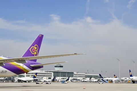 Thai Airways Boeing B777 Dreamliner in front of satellite Terminal 2
