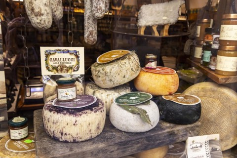 Cheese shop in the narrow streets of the old town of Pienza