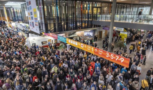 Entrance to the travel trade fair with many visitors