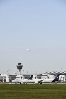 Lufthansa aircraft Airbus 321 Neo waiting for take-off clearance on runway south with tower