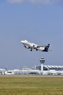 Taking off Lufthansa Airbus A320-200 on runway south with tower