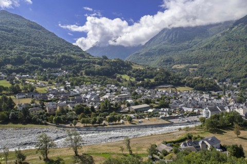 Aerial view over the village Luz-Saint-Sauveur and the Bastan river