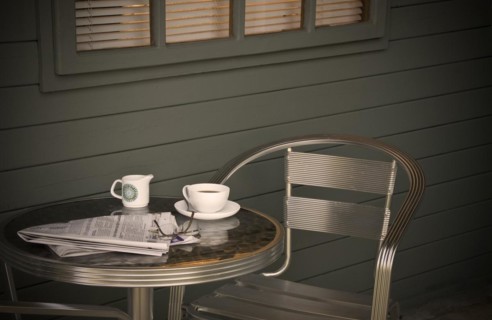 Cup of coffee and newspaper