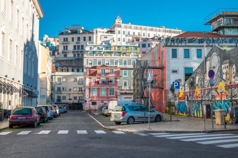 Old houses in narrow alleys and historic streets. Old house fronts in the morning and in the sunshine with reflection