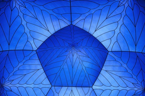 Incidence of light through a blue tent dome