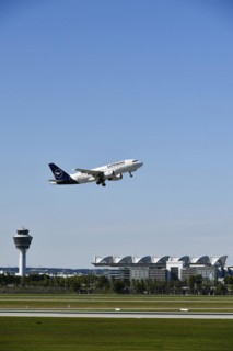 Taking off Lufthansa Airbus A319-112 on runway south with tower