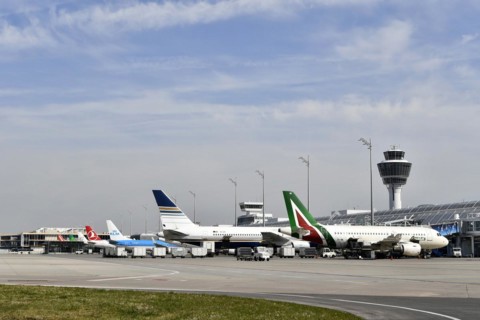 Aircraft on check-in position at Terminal 1 with tower