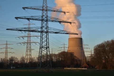 Hot steam comes out of a cooling tower