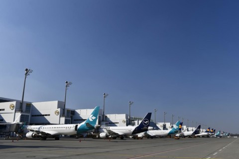 Lufthansa and Air Dolomiti aircraft parked in position at Terminal 2