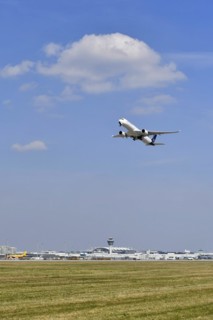 Lufthansa Airbus A350-900 taking off on runway south with tower