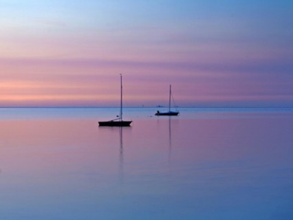 Two sailing boats on the North Sea in the evening light