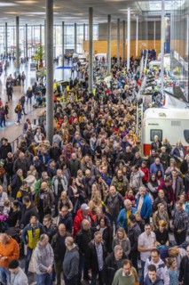 Entrance to the travel trade fair with many visitors