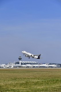 Taking off Lufthansa Airbus A320-200 on runway south with tower