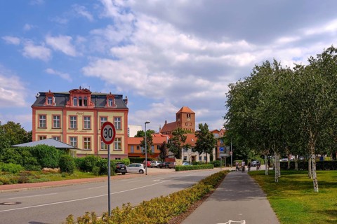 Town view with the Harmonie Hotel and the Georgenkirche in the historic town centre of Waren an der Mueritz
