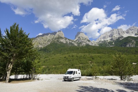 Camping bus on the dry riverbed of the Valbona