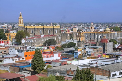 Aerial view over the city Cholula and the 16th century San Gabriel Franciscan Convent