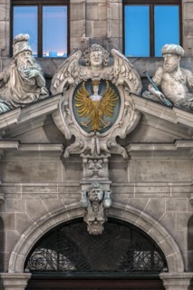 Coat of arms and sculptures on the upper entrance portal of the historic Wolf Town Hall