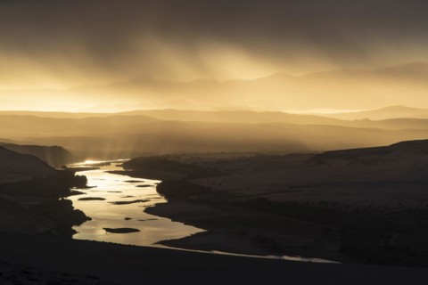 Thunderstorm over the Orange River, also known as the Orange River, on the border between Namibia and South Africa, Oranjemund, Sperrgebiet National Park, also known as Tsau ÇKhaeb National Park, Nam...