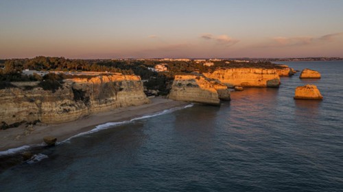 Sunset at Praia da Marinha, rocks and cliffs, steep coast in the Algarve, Portugal, Europe