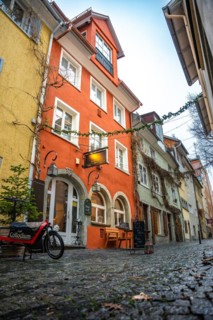 Dreamy alleyway alley with rain and colourful houses, Lindau Island, Lake Constance, Germany, Europe