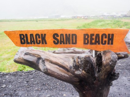 Rainy atmosphere, signpost to Reynisfjara beach, black lava beach, Vik, South Iceland, Iceland, Europe