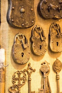 Retro styled keys and locks are hanging on a wall
