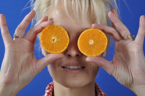 Portrait of womanwith a clementine