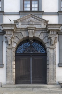 Cattle skull at the entrance portal of the Stadtmetzg, former slaughterhouse, today administration, Augsburg, Bavaria, Germany, Europe