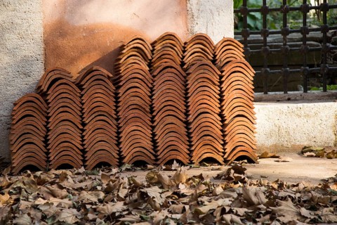 Pile of roofing tiles as a construction material at a building suppliers