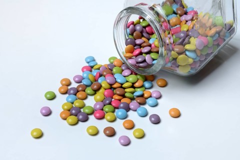 Chocolate lentils with glass container, Smarties