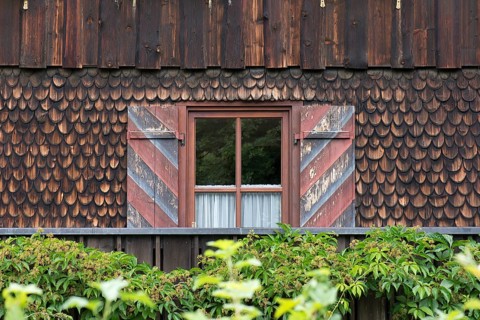 Wooden shingle facade with window and ornate shutters, Allgaeu, Bavaria, Germany, Europe
