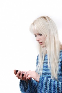 Portrait of blond woman phoning