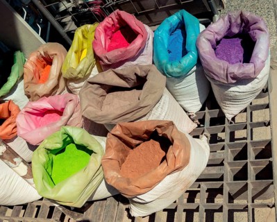 Sacks with paint pigment in different colors for sale