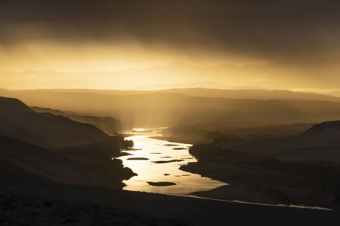 Thunderstorm over the Orange River, also known as the Orange River, on the border between Namibia and South Africa, Oranjemund, Sperrgebiet National Park, also known as Tsau ÇKhaeb National Park, Nam...