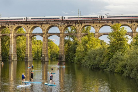 Enz viaduct Bietigheim with InterCityExpress ICE of Deutsche Bahn, railway viaduct over the river Enz, stand-up paddler, Bietigheim-Bissingen, Baden-Wuerttemberg, Germany, Europe