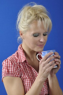 Woman drinking a hot drink