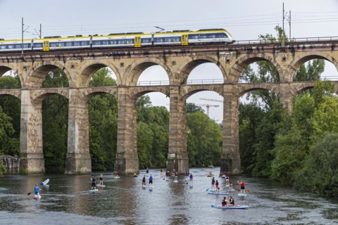 Enz viaduct Bietigheim with regional train, railway viaduct over the river Enz, stand-up paddler, Bietigheim-Bissingen, Baden-Wuerttemberg, Germany, Europe