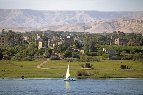 Felucca or traditional sailing boat on the Nile, behind Luxor and the Eastern Desert, Egypt, Africa
