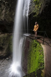 Hiker at Levada do Moinho, Waterfall in a gorge, Ponta do Sol, Madeira, Portugal, Europe